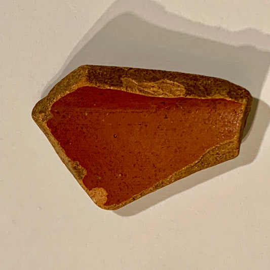 Antique. Roman Samian pottery sherd, from the 3rd century.