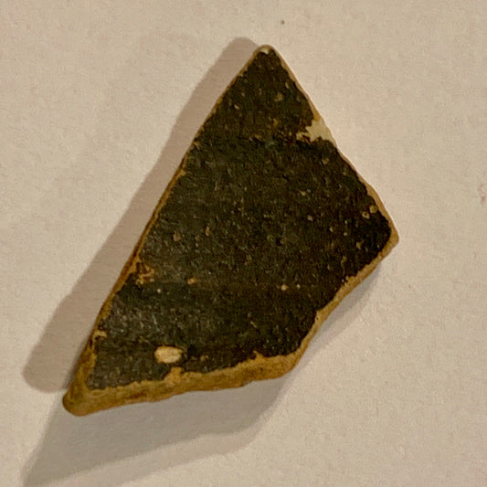 Antique. Roman Samian pottery sherd, from the 3rd century.