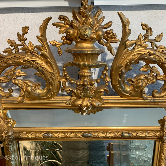 Antique German gilded mirror from the Historicism period.