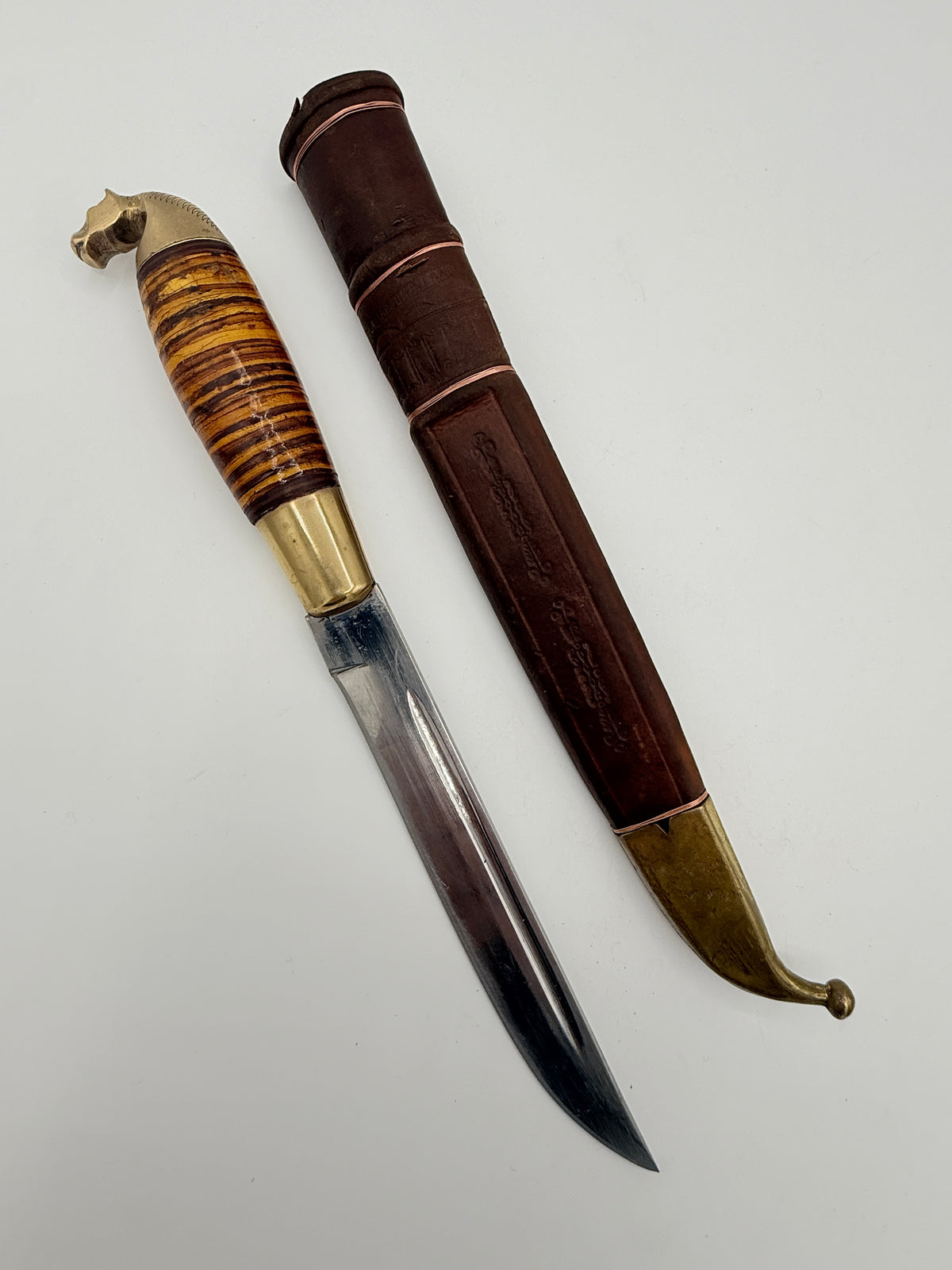 Vintage knife with wooden handle and metal blade. Made in Finland. Mid 20th century