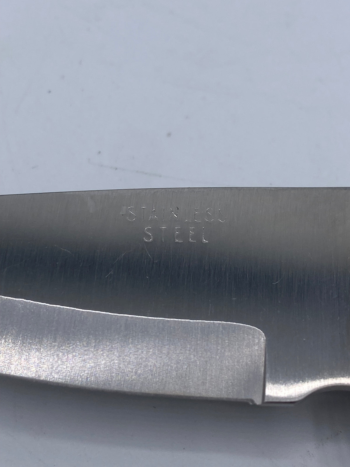 Folding knife after Barry Woods design in stainless steel and wood.