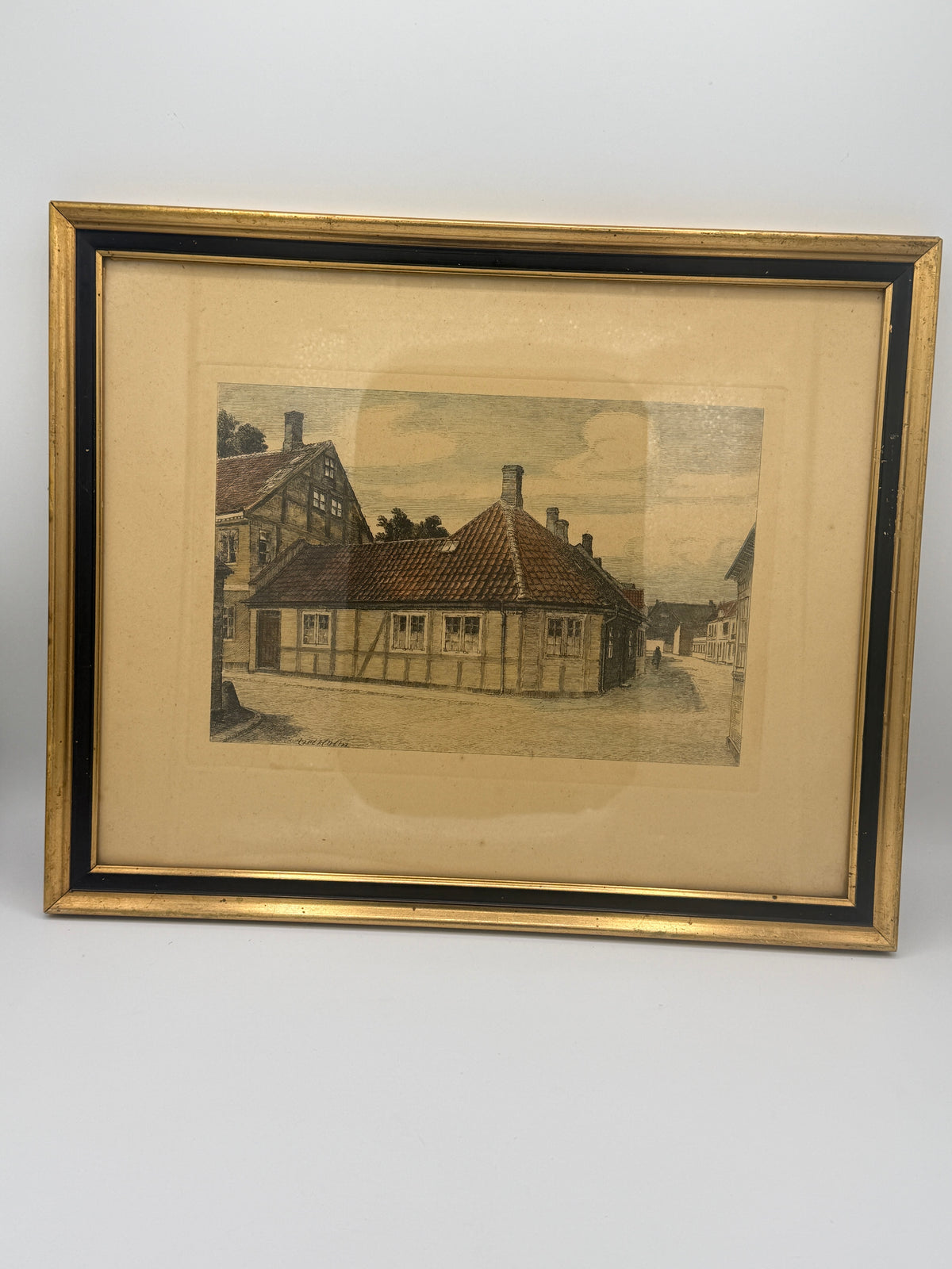Et håndkoloreret radering af H.C. Andersens hus i Odense fra 1920'erne