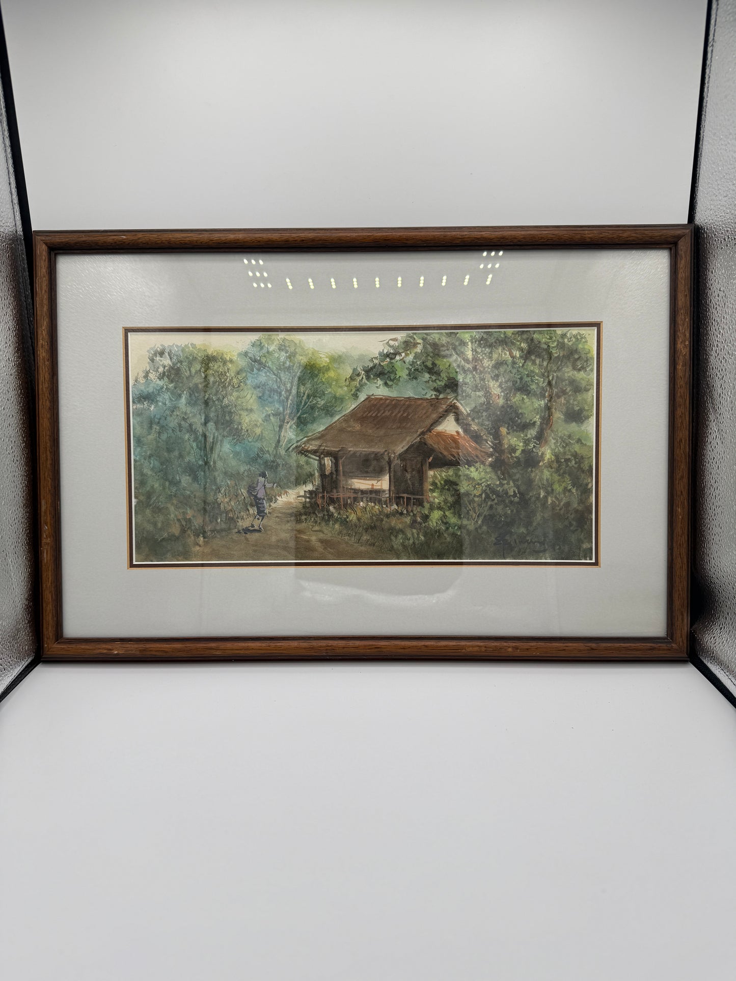 Impressionistisk akvarel af landsbyhytte med figur. Indonesien. Slut 20. Årh. Signeret