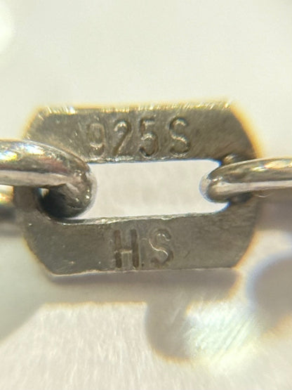 An antique silver necklace from the mid-20th century