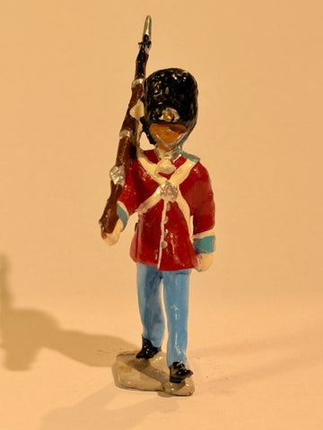 Brigadier Royal Life Guards tin soldier. Marching with rifle.