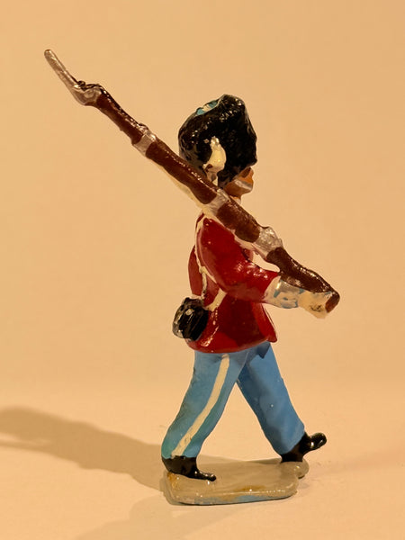 Brigadier Royal Life Guards tin soldier. Marching with rifle.