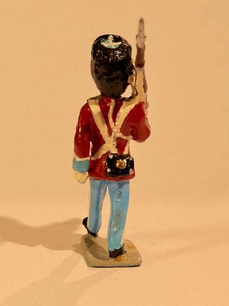 Brigadier Royal Life Guards tin soldier. Marching with rifle.