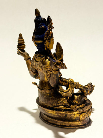 Laxmi, en gudinde fra 1900 tallet, i forgyldt og oxideret kobber