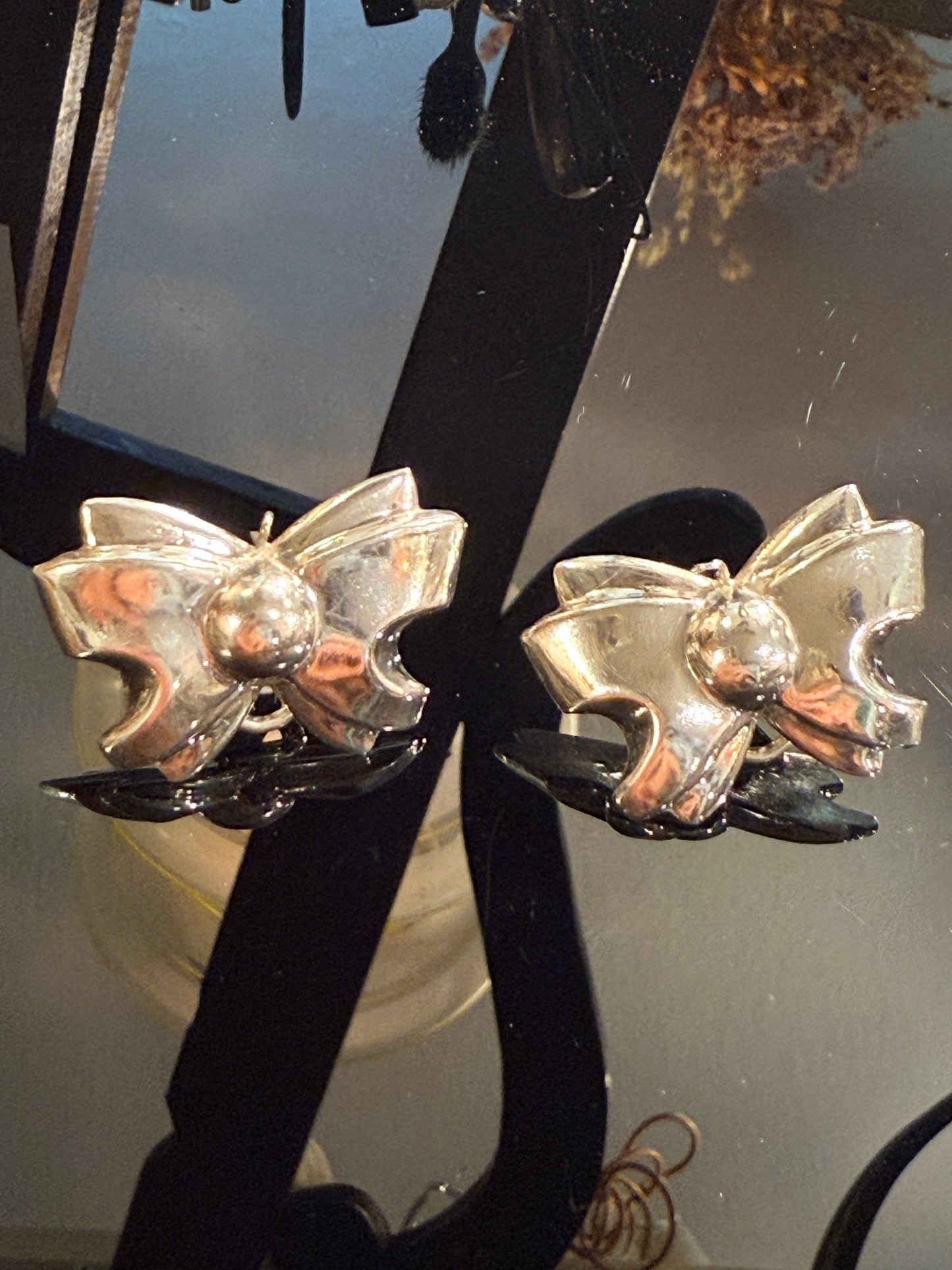 Vintage sterling silver bow earrings. From the late 1900s.