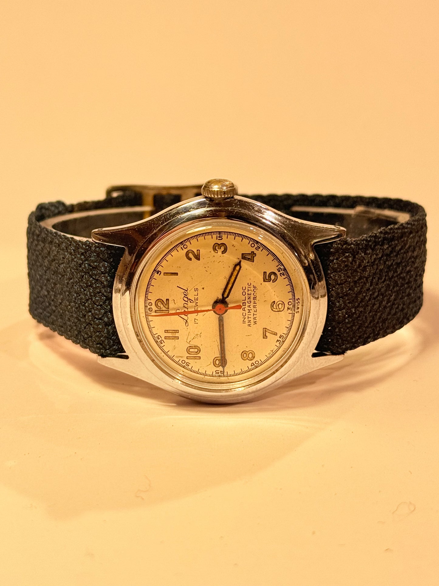 Vintage watch with black leather band. From mid/late 1950's