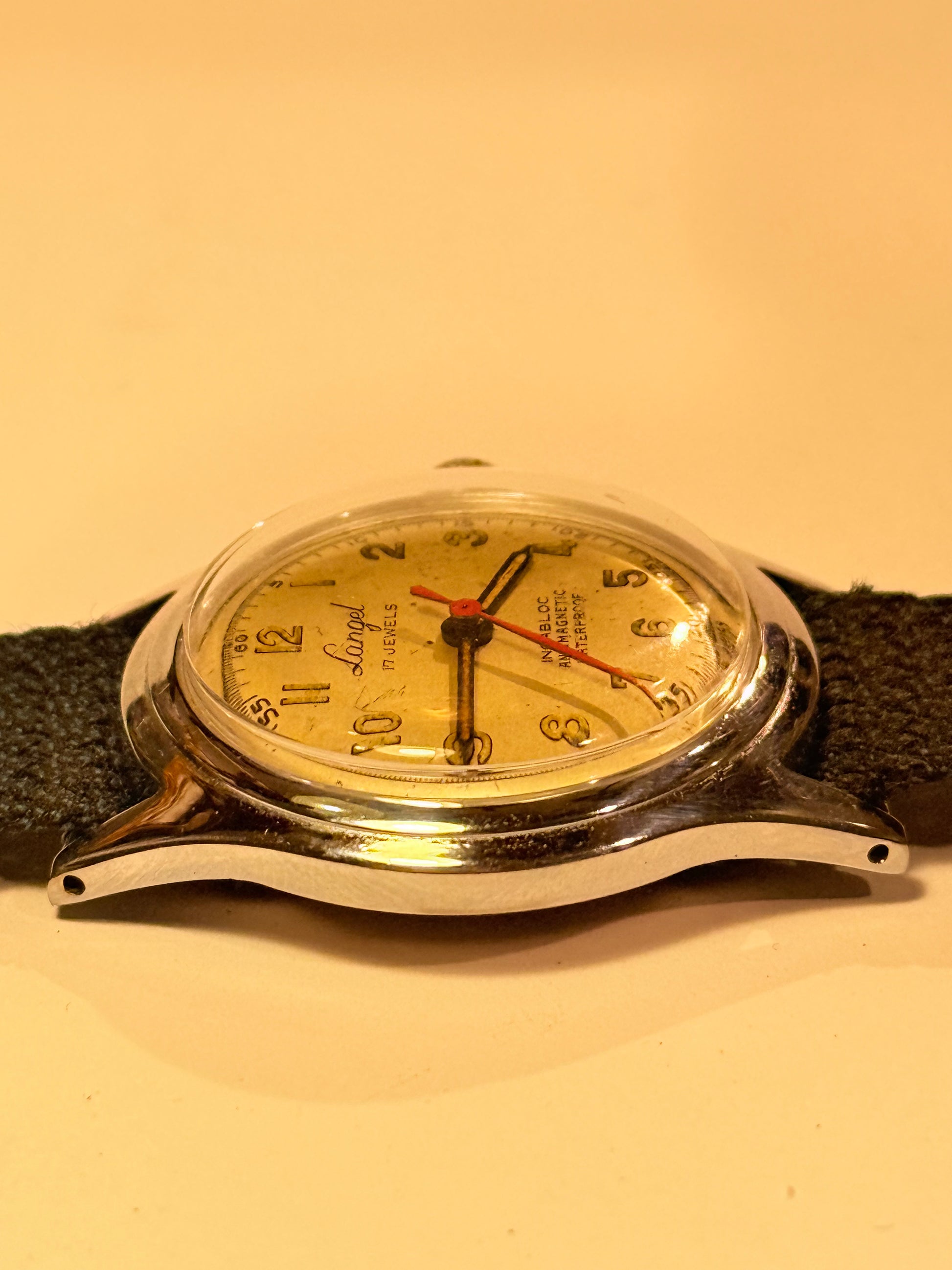 Vintage watch with a black leather strap. From the mid/late 1950s
