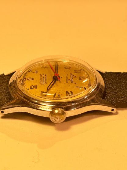 Vintage watch with a black leather strap. From the mid/late 1950s