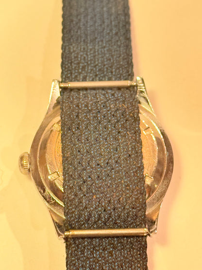 Vintage watch with a blue strap from the mid/late 1950s