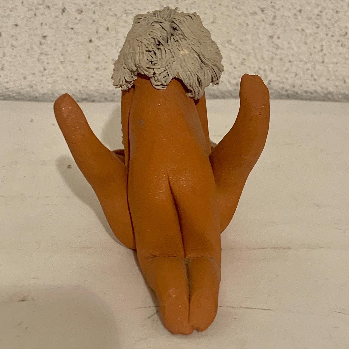 Vintage stoneware caricature figurine of loving couple.