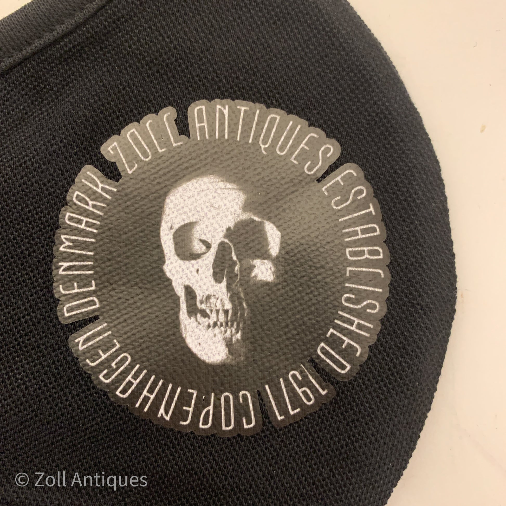 Zoll Antiques Skull Logo Mundbind