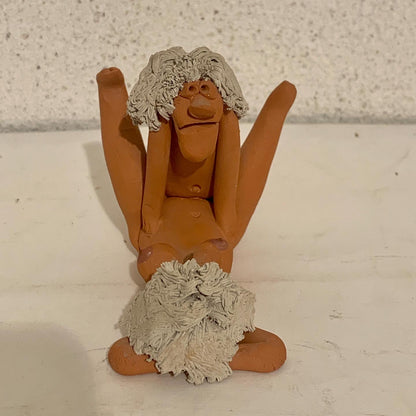 Vintage stoneware caricature figurine of loving couple.