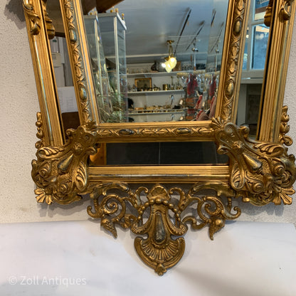 Antique German gilded mirror from the Historicism period.