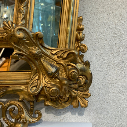 Antique German gilded mirror from the Historicism period.