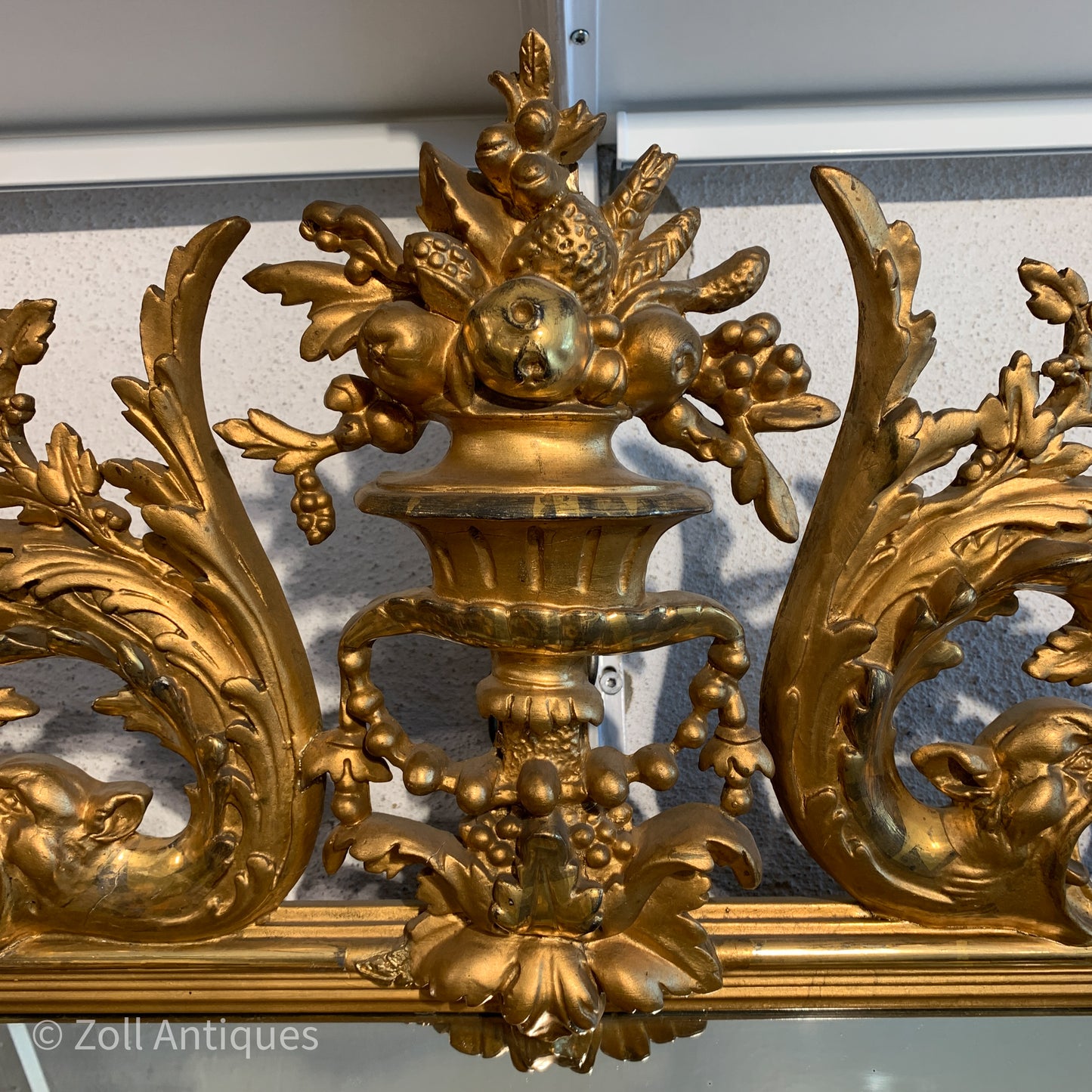 Antique German gilded mirror from the Historicism period.
